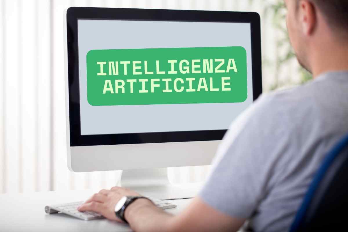 uomo guarda video al pc, scritta inteligenza artificiale