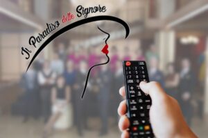 logo il paradiso e telecomando in mano