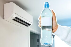 condizionatore e bottiglia acqua in mano