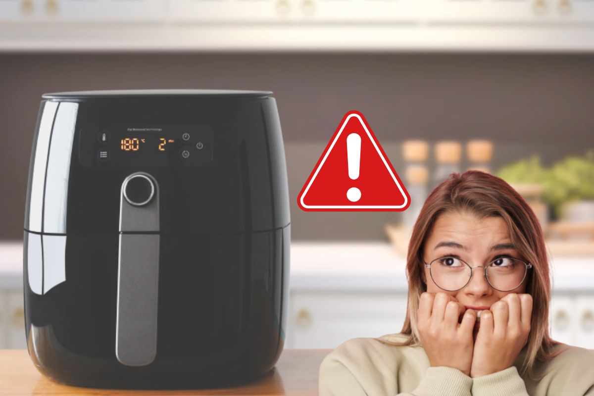 Ragazza preoccupata e friggitrice ad aria nello sfondo