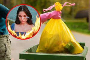 Una busta gialla dell'immondizia nel cassonetto e, in evidenza, una ragazza in mezzo alle fiamme